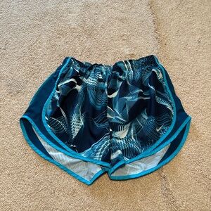 Nike Blue Athletic Shorts with Lightweight Material and Curved Hem